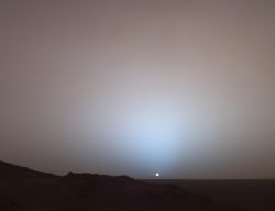 Rover Spirit images sunset at Gusev Crater in approximately true color. At the horizon, light scattering through the longer column of dust appears blue, as in a smoke-filled room. (NASA/JPL-Caltech/Texas A&M/Cornell University)